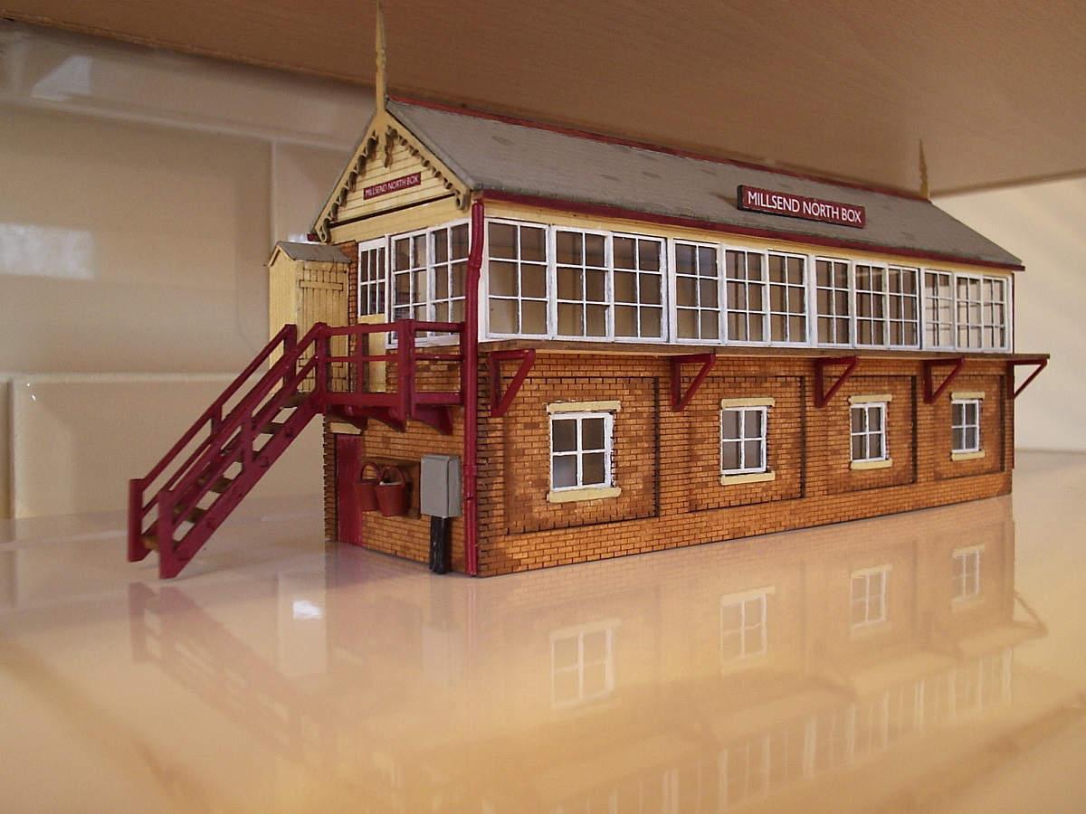Large signal box kit built by Jim Dobson of Fleetwood for his "Millsend layout".  Painted with thinned enamel paint. Additions to the kit plastic drain pipes, gutters made from sprue left over from the kit, water buckets, power box and name boards.